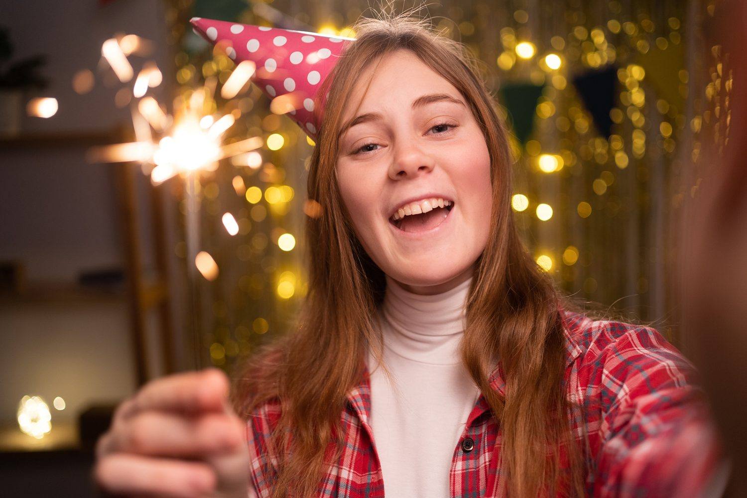 Girl With Sparkler Lights On Her Birthday While Celebrate At Hom